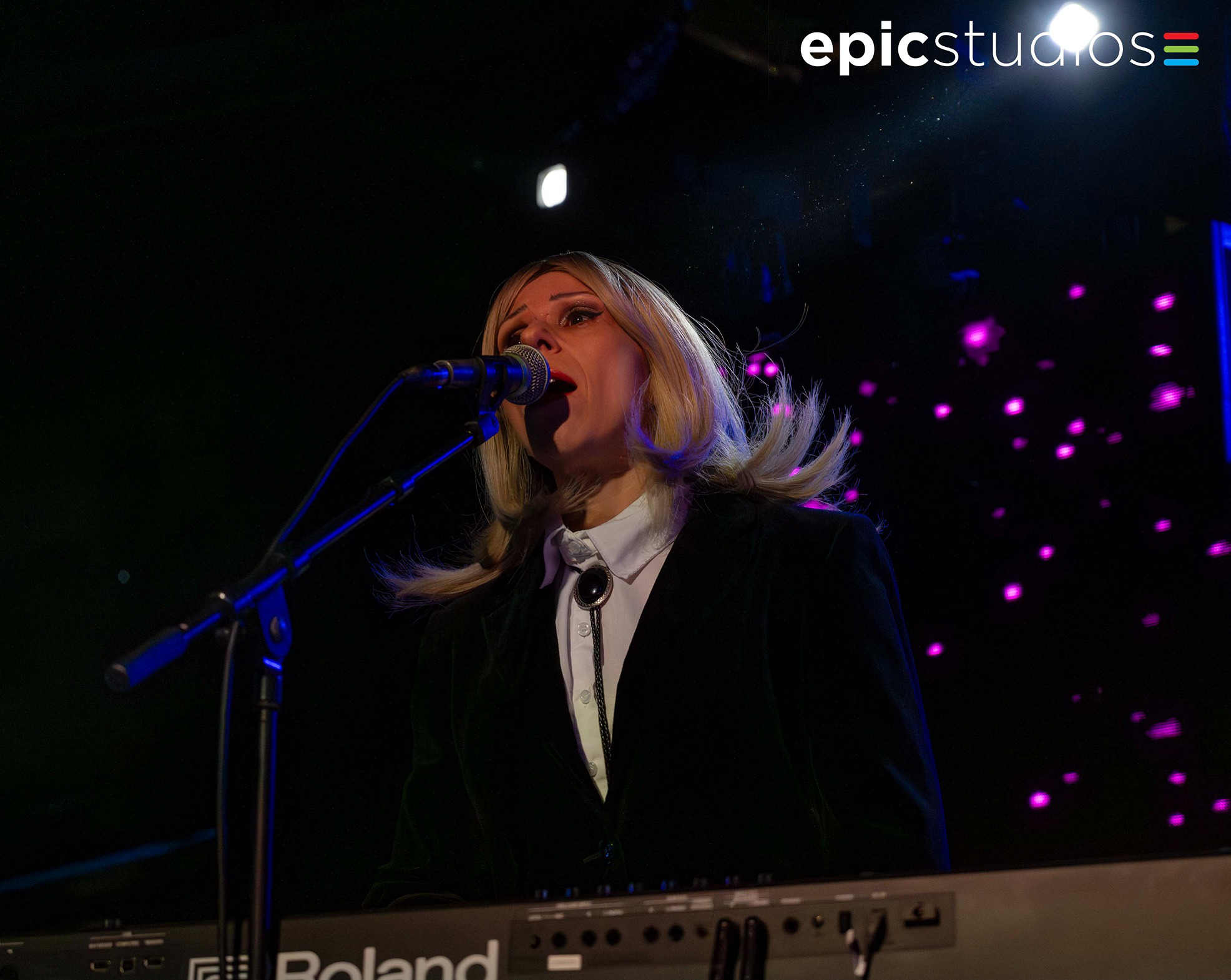 a man singing into a microphone