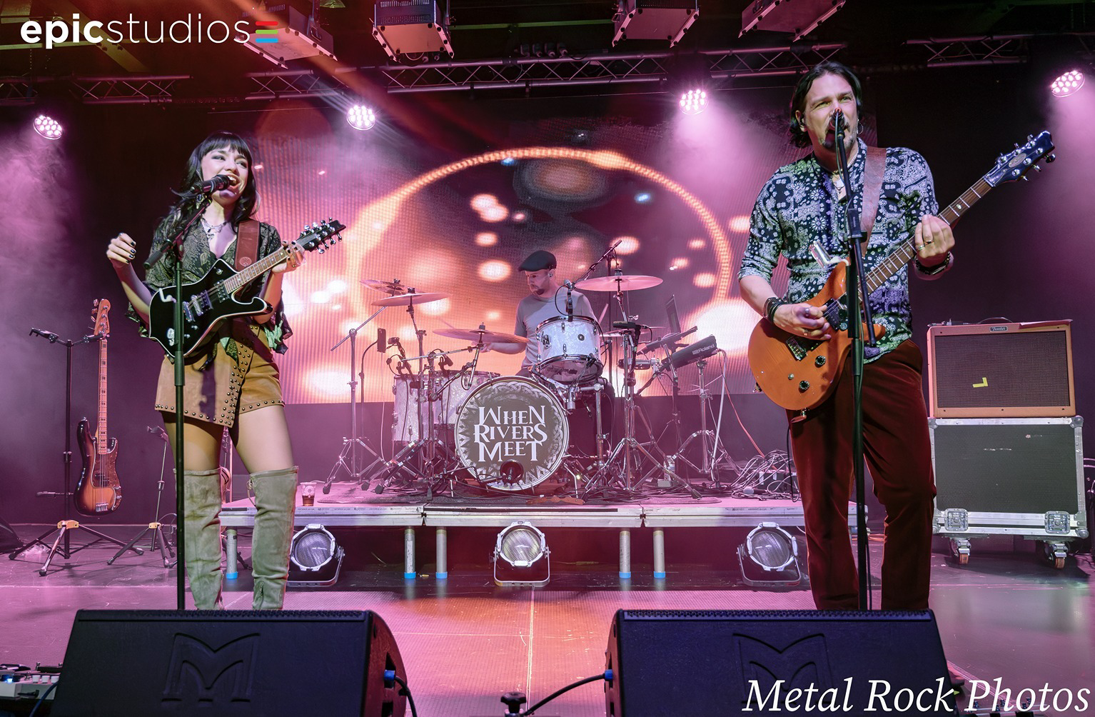a group of people playing instruments on a stage