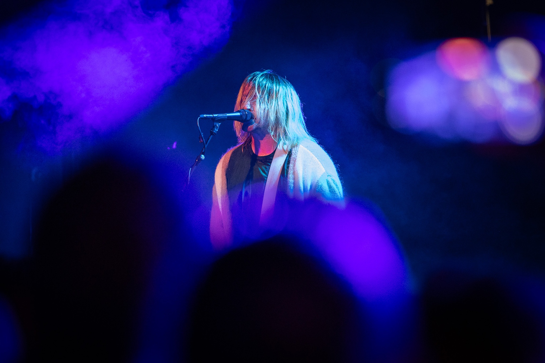 a person singing into a microphone