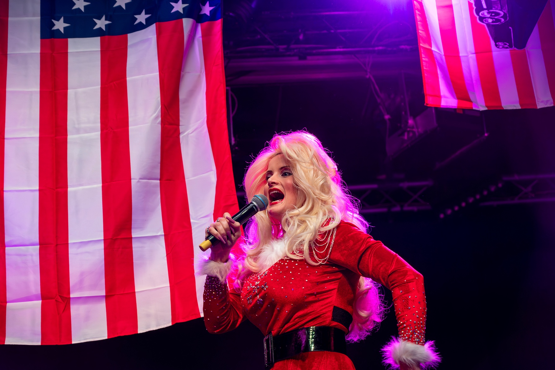 a person singing into a microphone