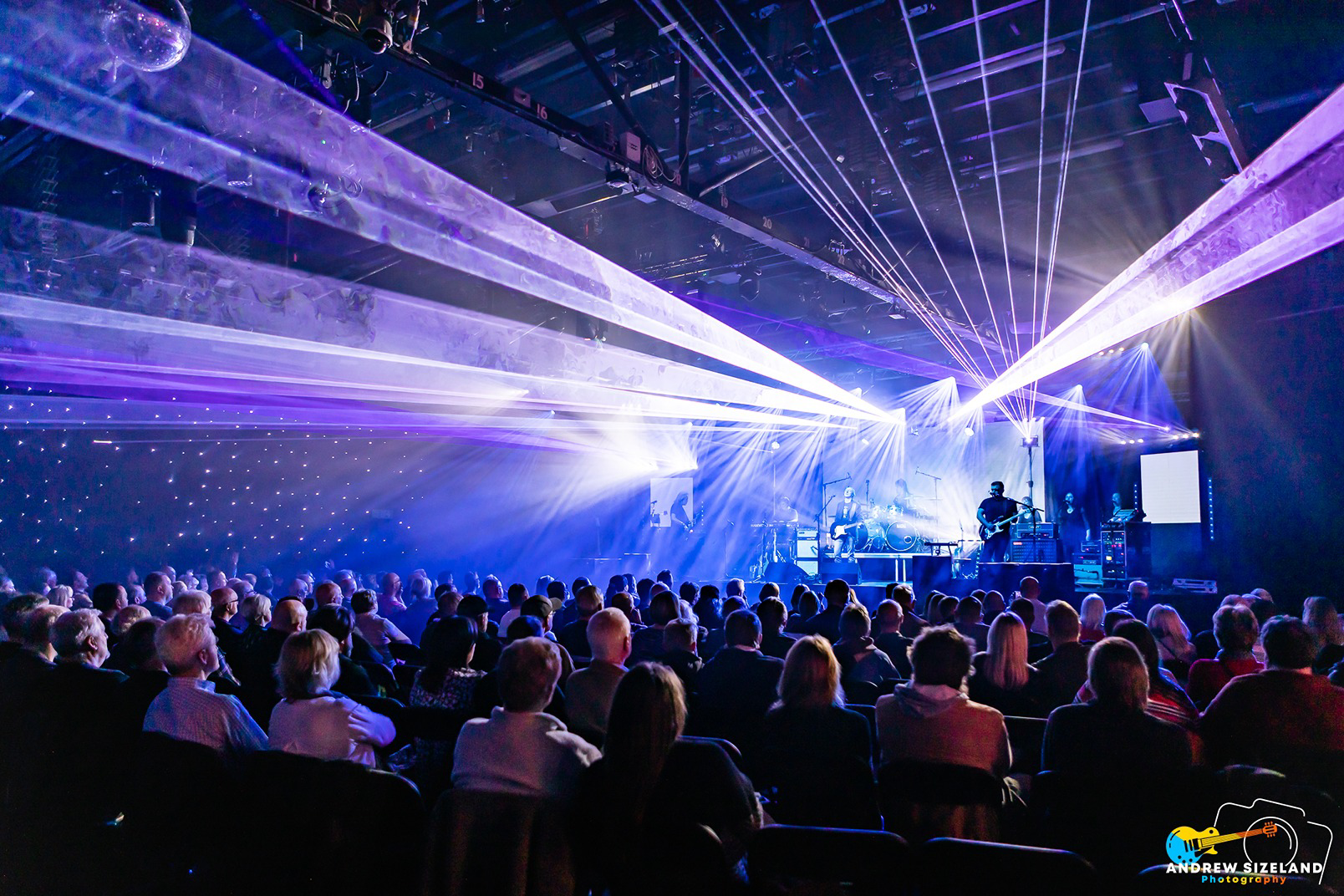 a crowd of people in a concert