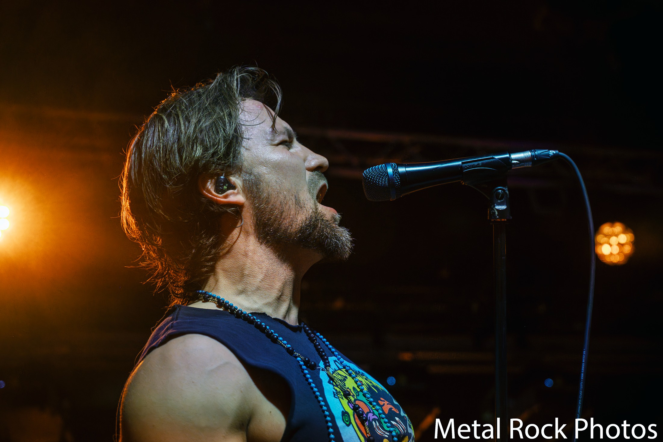 a man singing into a microphone