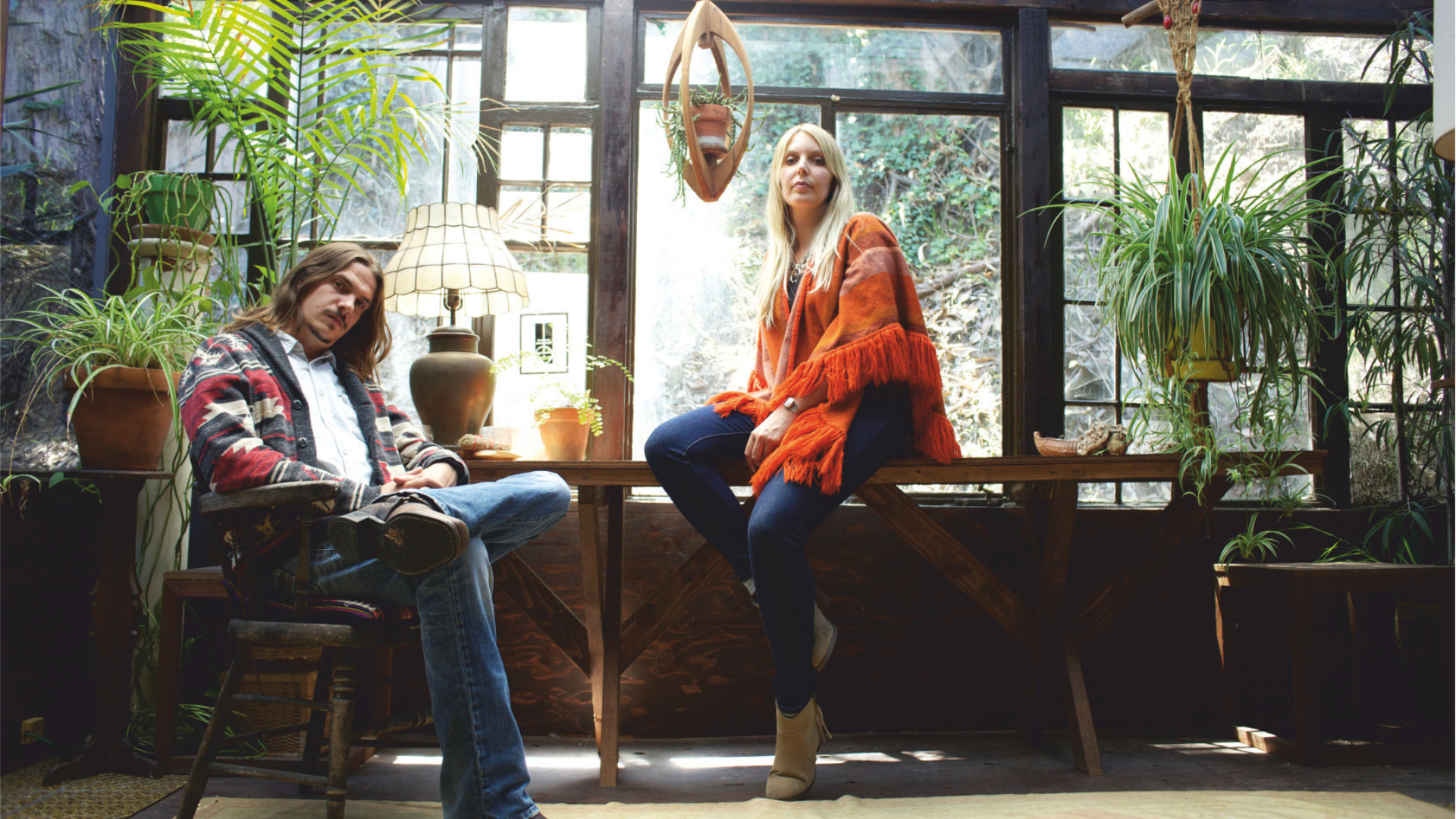 two women sitting on a bench