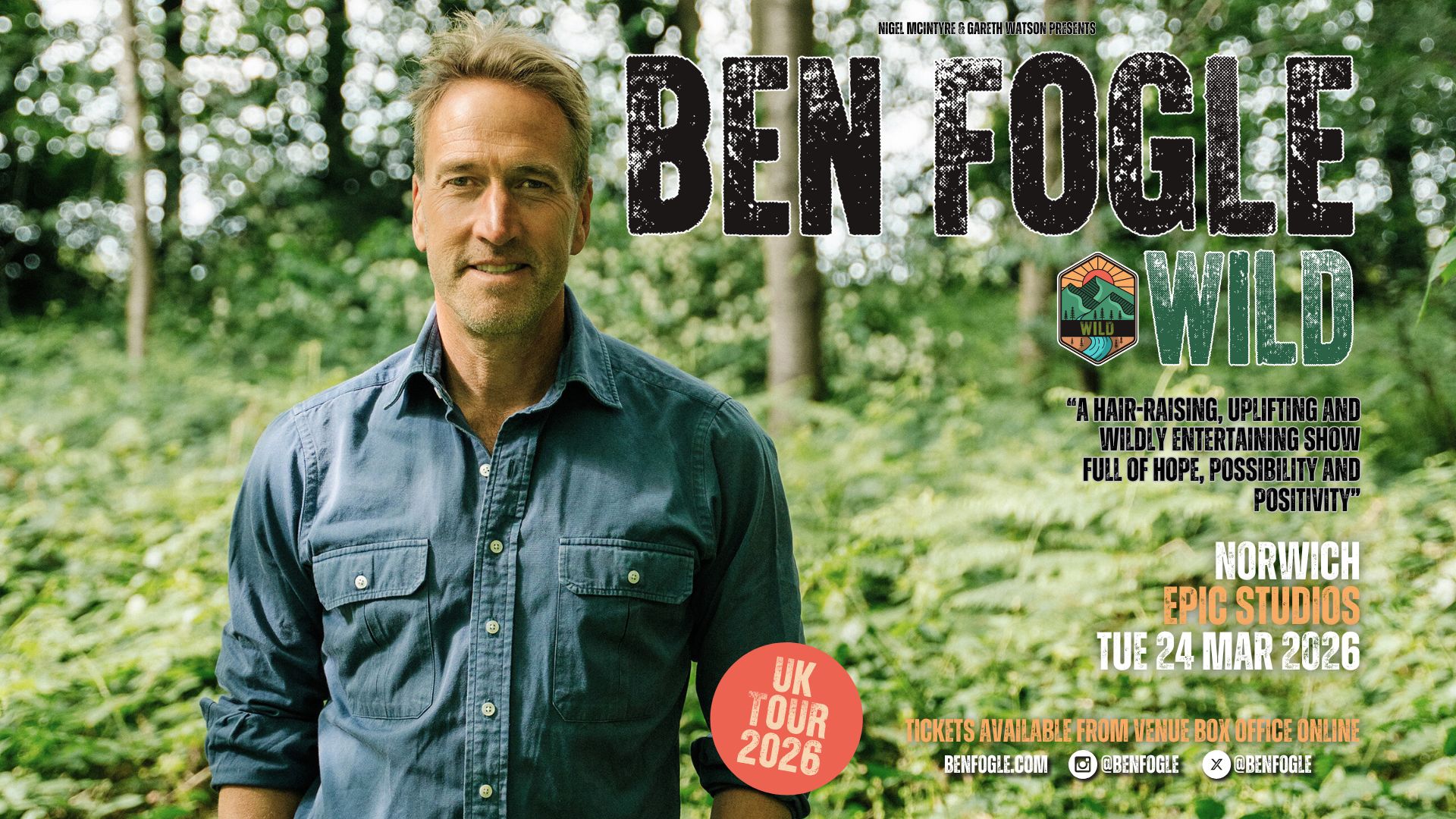 a man standing in front of a sign