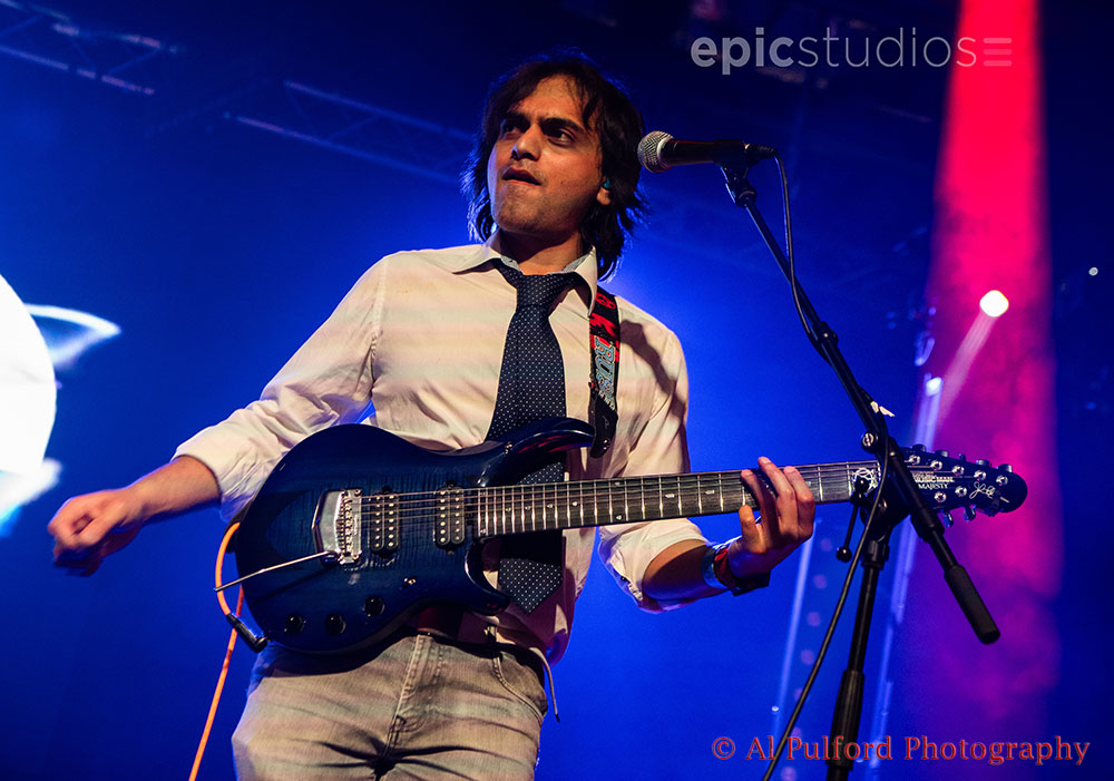 a man playing a guitar