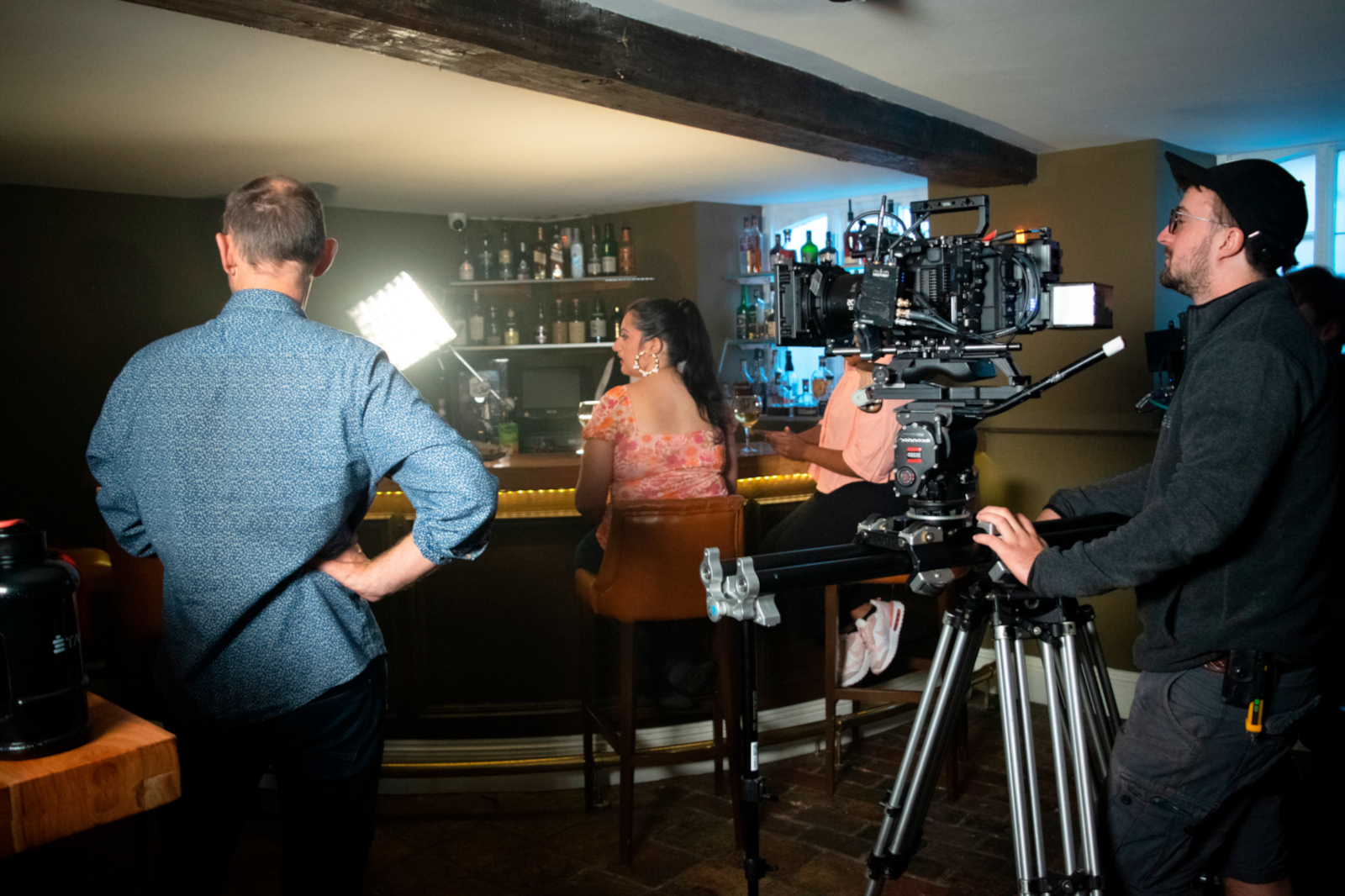 a man and woman looking at a camera