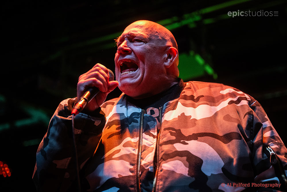 a man singing into a microphone