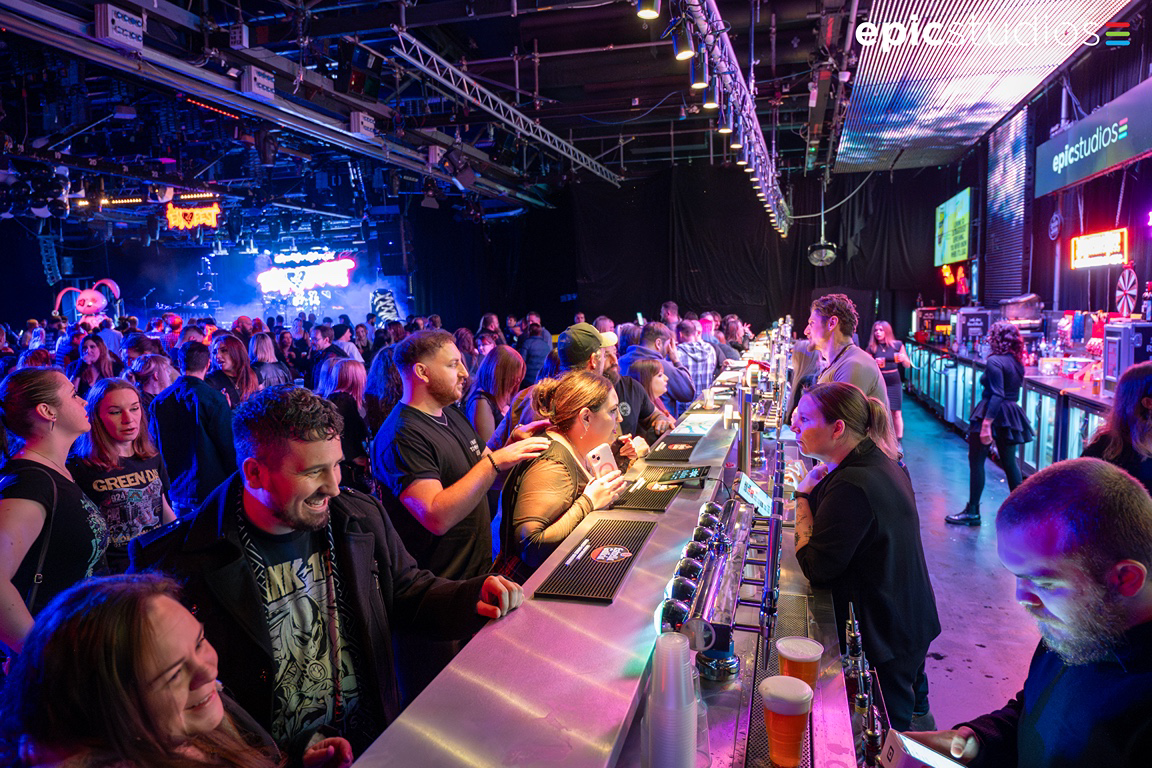 a large crowd of people at a bar