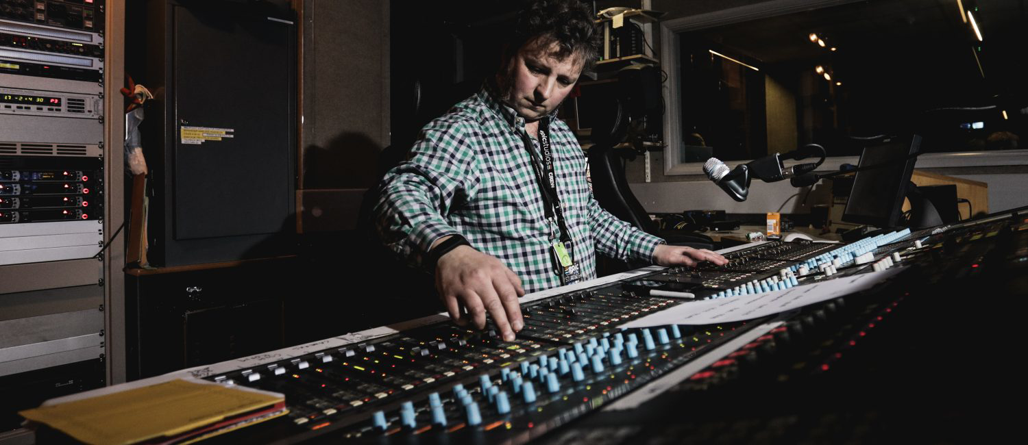 a man working on a sound board