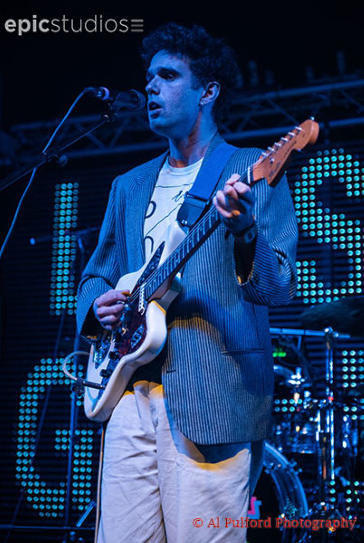 a man playing a guitar