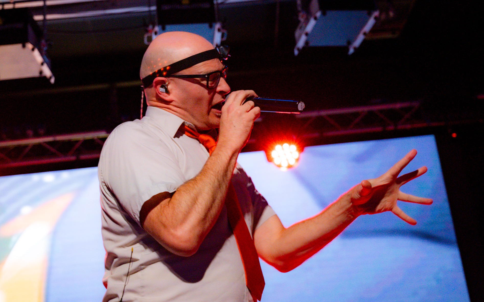 a man singing into a microphone