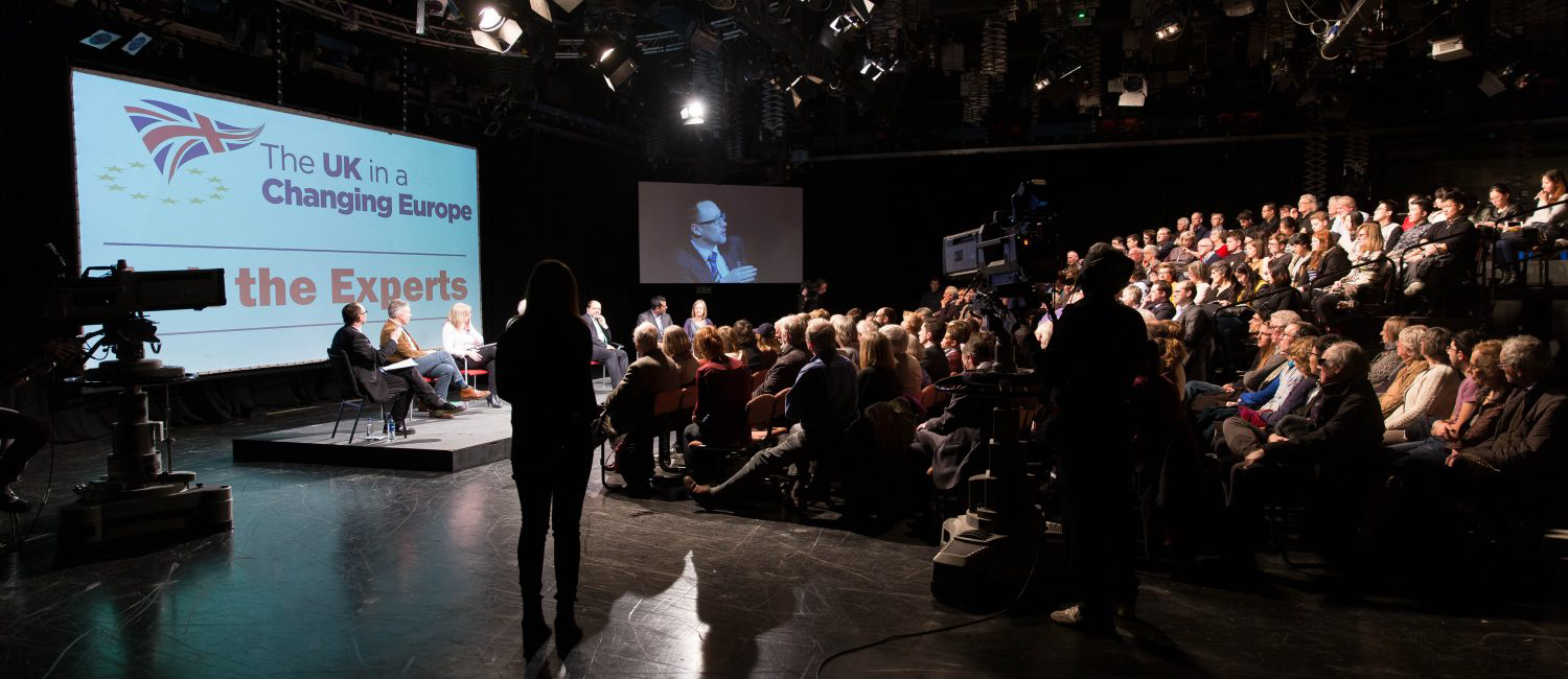 a person standing in front of a crowd of people