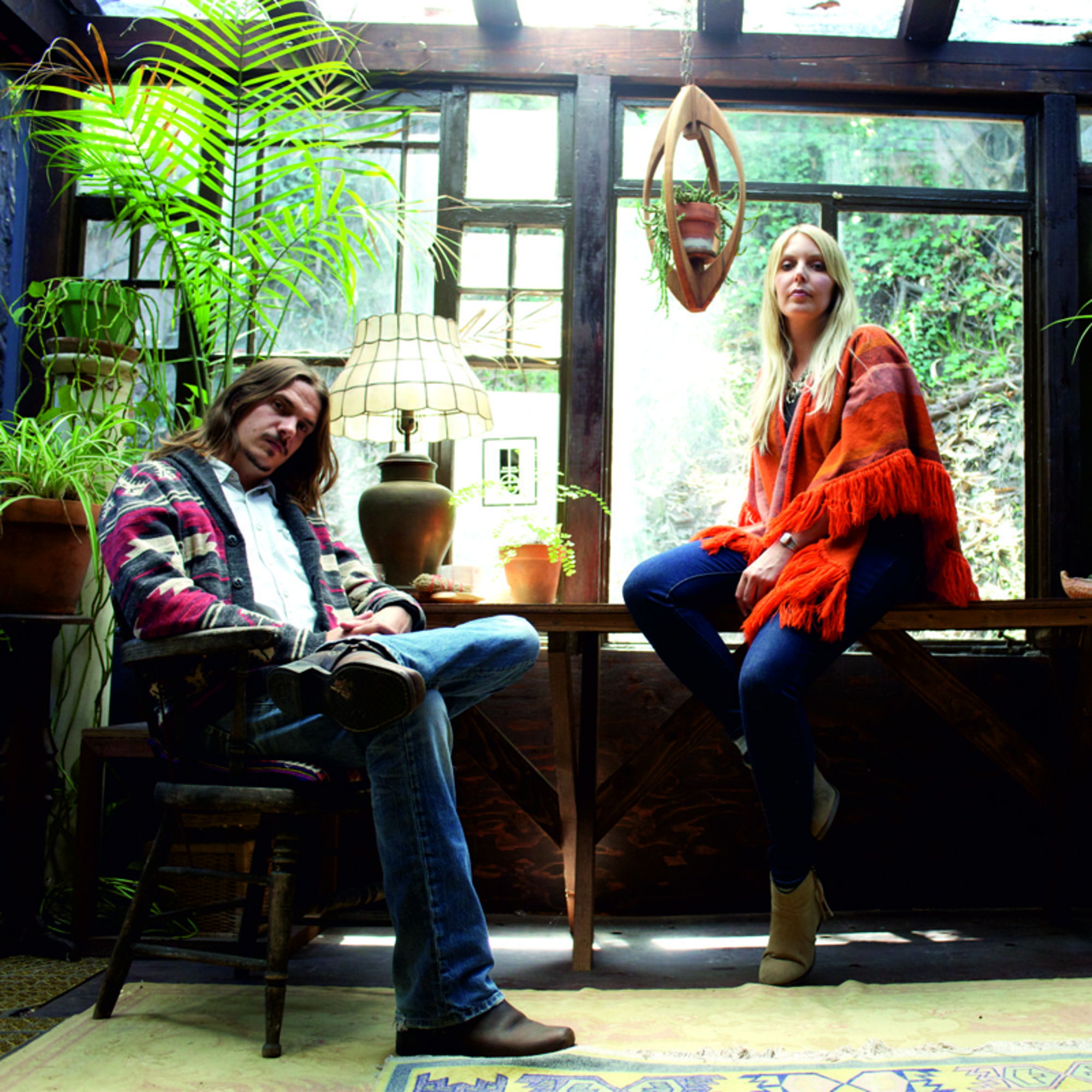 two women sitting on a bench