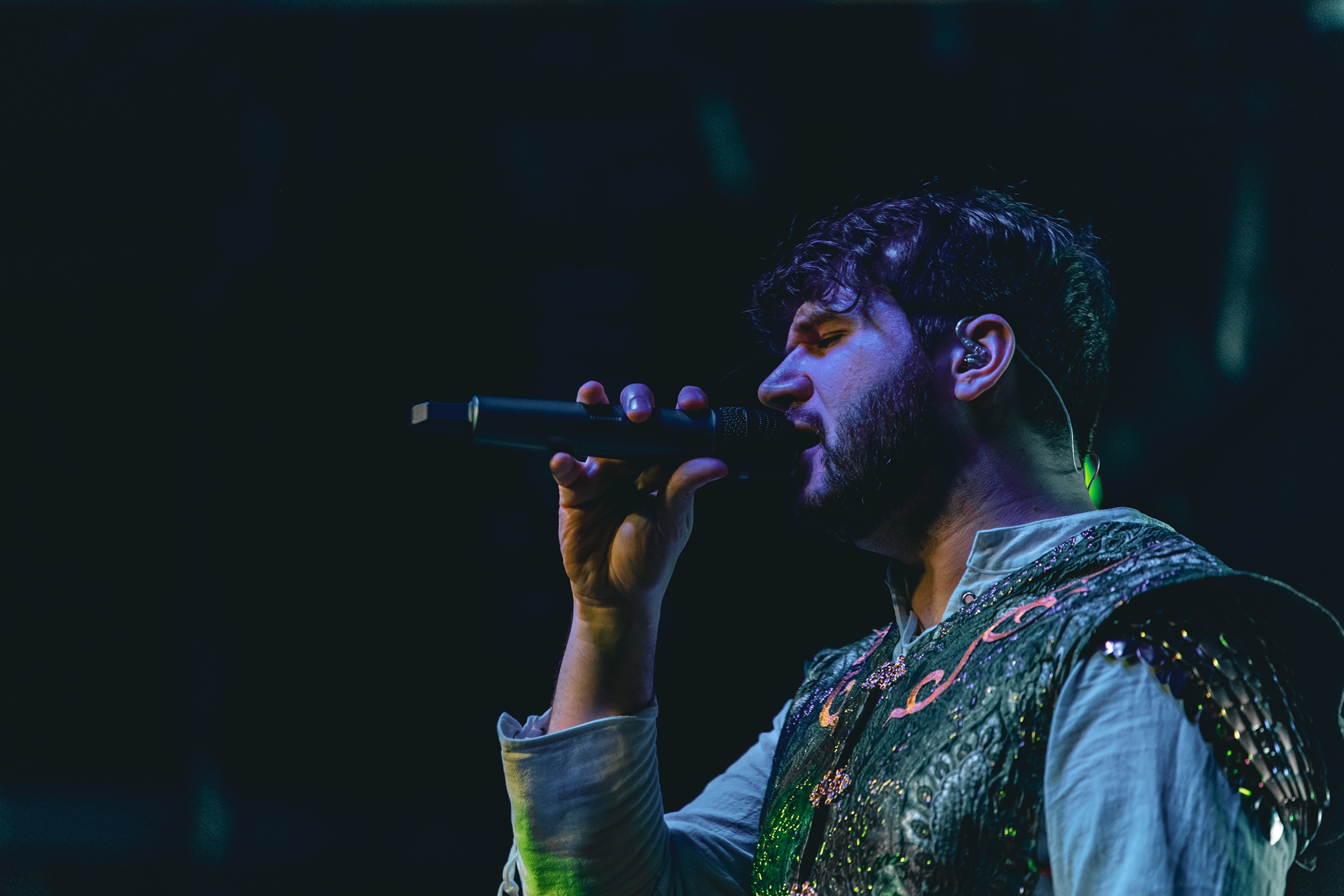 a man singing into a microphone