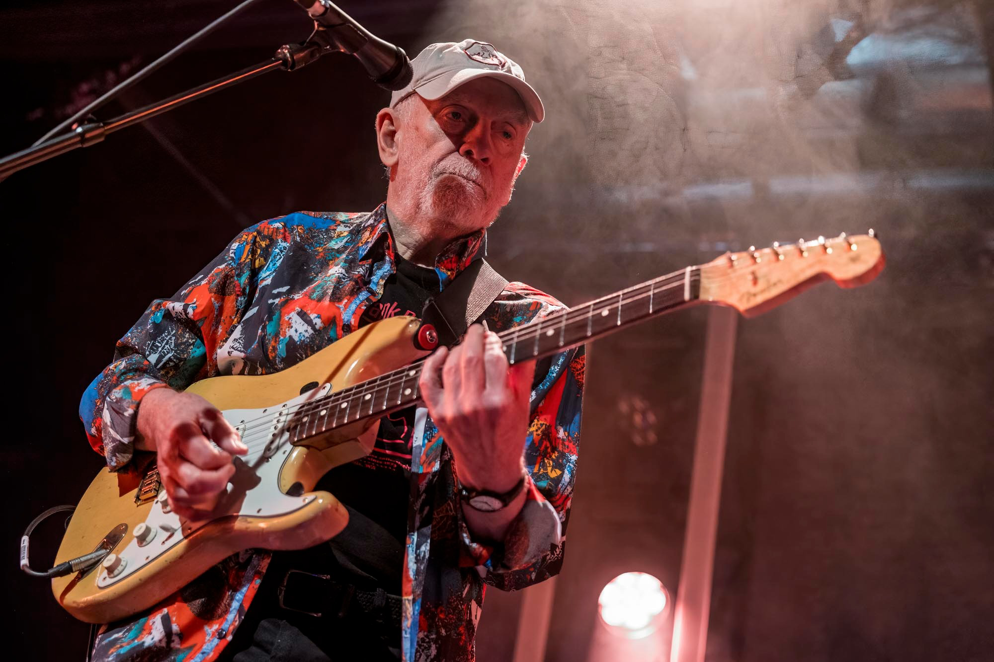 a man playing a guitar