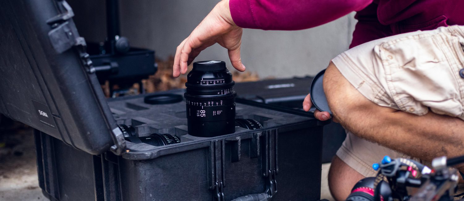 a man opening a black suitcase